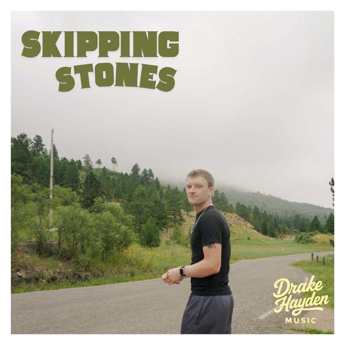 Skipping Stones album cover — Drake Hayden on a road in the mountains